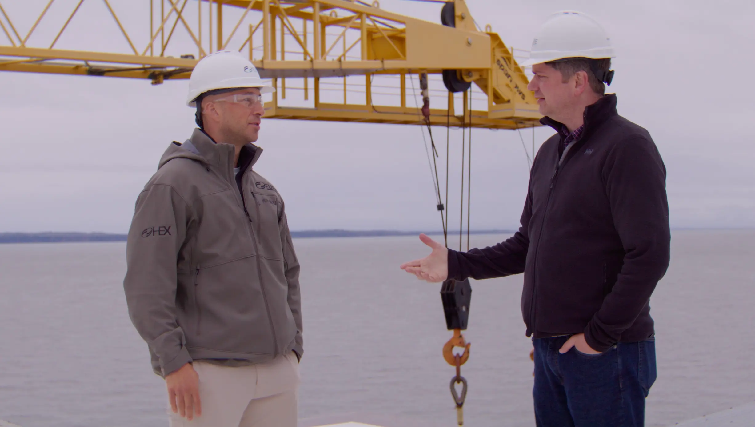 Congressman Begich talking with a worker at a waterfront site